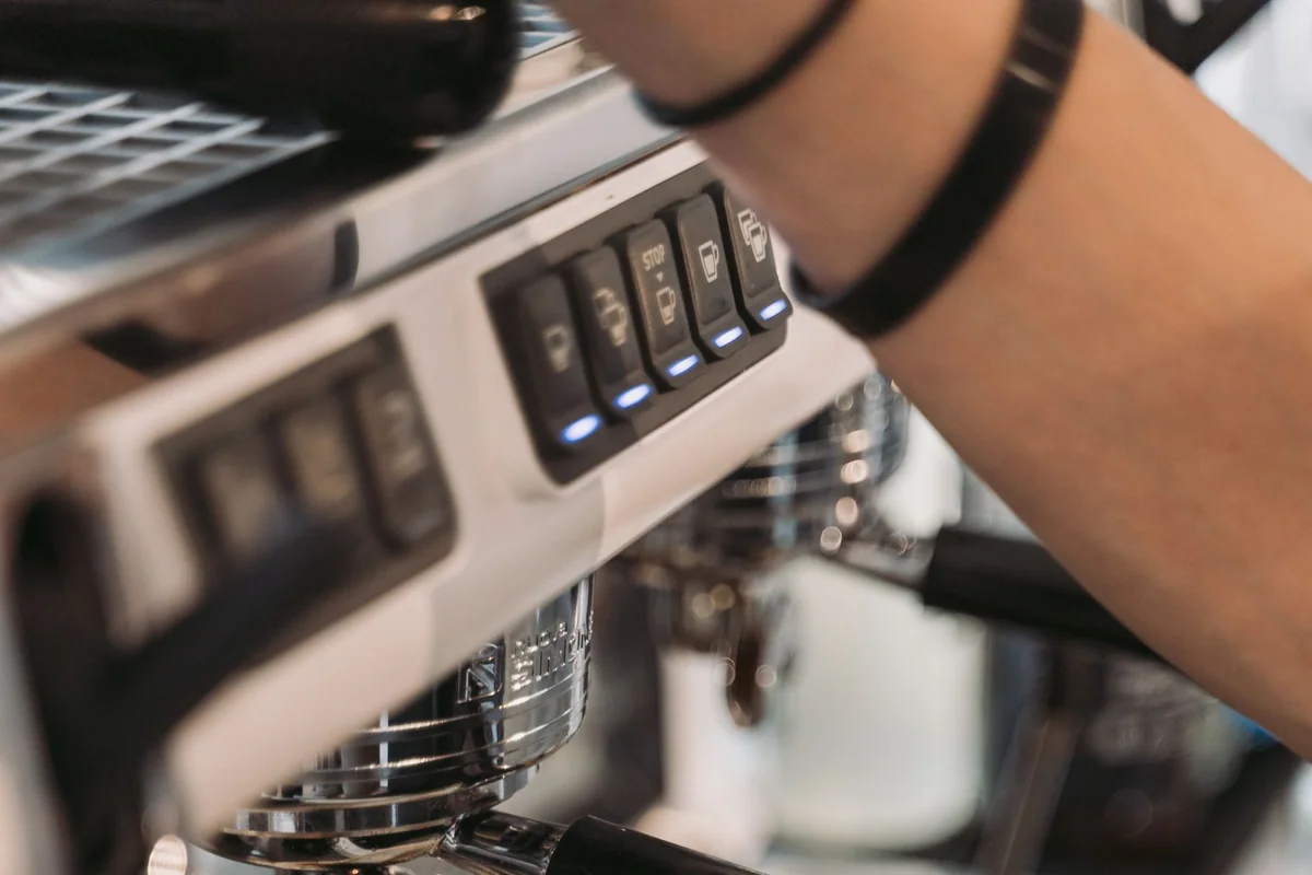 Coffee tools and mugs organized on a narrow kitchen tray