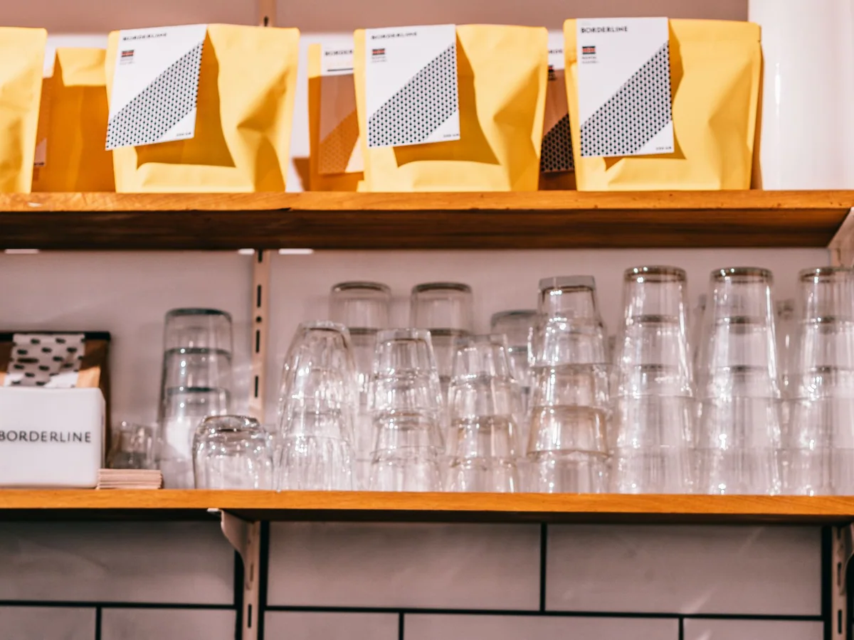 A compact coffee station arranged in a small kitchen corner