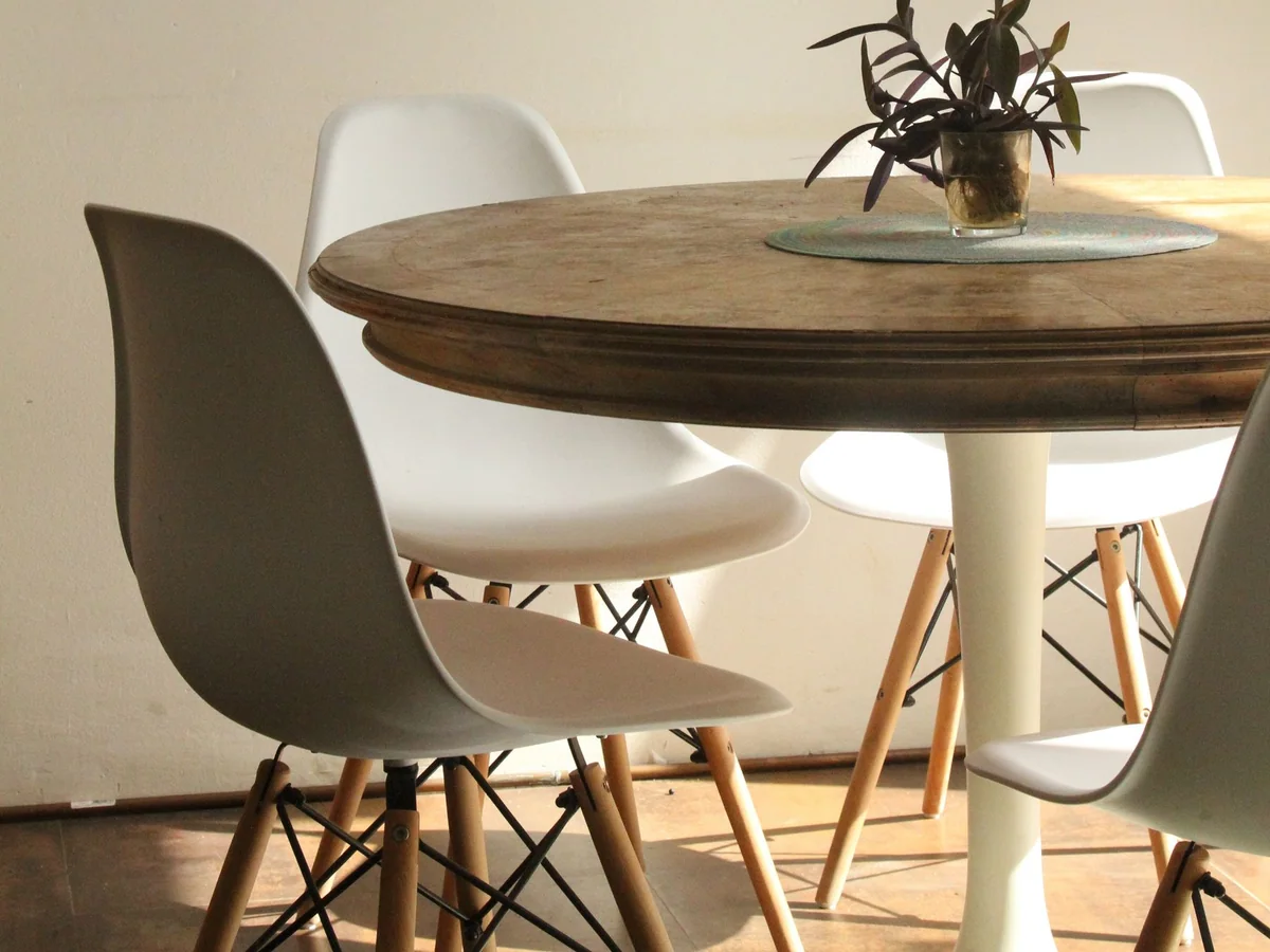 A drop-leaf dining table open in a one-bedroom apartment